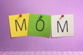 Mom text written on colorful paper note Royalty Free Stock Photo