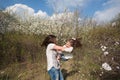 Mom throws daughter plays on the background of blue sky