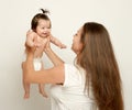 Mom throws up baby, play and having fun, parenting, happy family concept Royalty Free Stock Photo