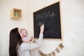 Mom and Toddler Daughter playing menu planning write to blackboard and chalk, Royalty Free Stock Photo