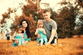 Mom with two daughters twins autumn