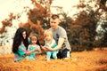 Mom with two daughters twins autumn