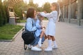 Mom and two lovely daughters are laughing merrily Royalty Free Stock Photo