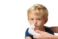 Mom using kids electric nasal aspirator Royalty Free Stock Photo