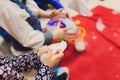 Mom wipes her daughter s palm with a damp napkin. Mom cares for her little daughter. Photo of children`s palms and Royalty Free Stock Photo