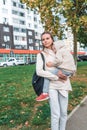 Mom woman autumn in park, little boy son of 3-5 years old, walks, sleeps, relaxes for walk, spring city green grass Royalty Free Stock Photo