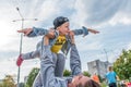 Mom woman with little boy son 4-5 years old, play airplane, have fun, laugh and enjoy rest, in summer city park site Royalty Free Stock Photo