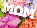 Mom word copy with gift and fllower Royalty Free Stock Photo