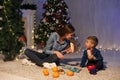 Mom and young boy open Christmas presents Christmas tree new year holiday Royalty Free Stock Photo