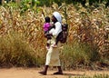 Mombasa / Kenya, Africa - 25 January, 2018: African woman walking with children in the village near Mombasa.