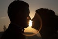 Moment of bride and groom at sunset