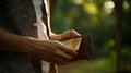 A moment of financial strain is captured as an Asian man\'s hand opens an empty wallet, AI generated Royalty Free Stock Photo