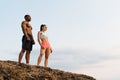 Moment of harmony. Happy mixed race couple athlethic caucasian woman and african american bodybuilder practising yoga Royalty Free Stock Photo