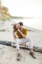 A moment before a kiss. Young couple is having fun and hugging on the beach. Beautiful girl embrace her boyfriend from Royalty Free Stock Photo