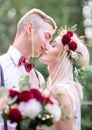 A moment before a kiss between young wedding couple