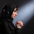 Moment of quiet faith as young woman prays Royalty Free Stock Photo