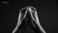 Clasped Hands in Solemn Prayer Royalty Free Stock Photo