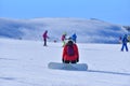 A Moment of Reflection - Snowboarder Takes a Break to Enjoy the Splendor of the Snowy Terrain