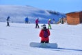 A Moment of Reflection - Snowboarder Takes a Break to Enjoy the Splendor of the Snowy Terrain