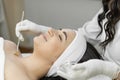 A moment of relaxation and bliss during skin peeling, when a woman enjoys caring for her skin during spa treatments in a