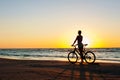 Moment in time. Sporty woman cyclist silhouette on multicolored