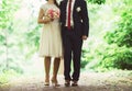 Moment in wedding, bride and bridegroom holding hands with bouqu Royalty Free Stock Photo