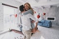 Moments of intimacy. Beautiful young couple embracing and smiling while spending time in the bedroom Royalty Free Stock Photo