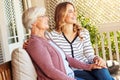 Moments of nostalgia. a senior woman sitting outside with her adult daughter. Royalty Free Stock Photo