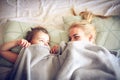 Mommy lets hide under blanket. Royalty Free Stock Photo