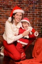 Mommy and little son in christmas festive attires Royalty Free Stock Photo