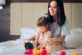 Mother and Daughter Having a Tea Pajama Party in Bed Royalty Free Stock Photo