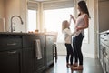 Moms got the moves. a happy mother dancing with her little girl in the kitchen at home. Royalty Free Stock Photo