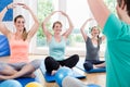 Moms in postnatal regression course doing yoga Royalty Free Stock Photo