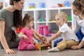 Moms with their babies in nursery Royalty Free Stock Photo