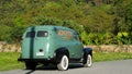 Mon Jodd sign on vintage classic car in Theme park with flower fields, European style buildings, antique columns and