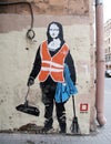 Mona Lisa as a janitor painted on the house wall