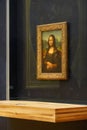 The Mona Lisa original painting on display in the Louvre Museum. The Mona Lisa is a half-length portrait painting by Italian artis Royalty Free Stock Photo