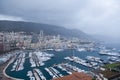 Monaco bay with lot of boats on a rainy day.