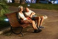 Monaco France 16 August 2017 : Homeless couple . Man is sleeping on a park bench in the city Royalty Free Stock Photo