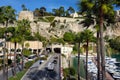 Monaco, Monaco - January 28, 2020: Prince Palace on rock in Mediterranean Sea, road under rock and bay with yachts Royalty Free Stock Photo