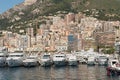 Monaco, Monaco - July 08 2008: Luxury yachts in the Monaco harbor with large apartment complexes in the background..