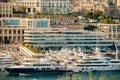 Monaco, Monte Carlo, 21 August 2017: Aerial view of port Hercules at sunset, mega yachts are moored in marina near yacht Royalty Free Stock Photo