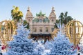 Monaco, Monte-Carlo, 25 December 2019: The square Casino Monte-Carlo at sunset, white Christmas trees, hotel the Paris, sunny day Royalty Free Stock Photo