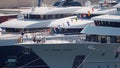 Monaco, Monte-Carlo, 29 September 2022: Rich megayacht owners sit at a table on the bow of a huge motor yacht, the world