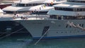 Monaco, Monte-Carlo, 29 September 2022: Rich megayacht owners sit at a table on the bow of a huge motor yacht, the world