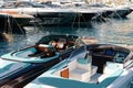 Monaco, Monte Carlo, 28 September 2022 - Riva boats in a row and a lot of luxury mega yachts at the famous motorboat Royalty Free Stock Photo