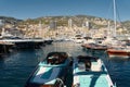 Monaco, Monte Carlo, 28 September 2022 - Riva boats in a row and a lot of luxury mega yachts at the famous motorboat Royalty Free Stock Photo