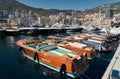 Monaco, Monte Carlo, 28 September 2022 - Riva boats in a row and a lot of luxury mega yachts at the famous motorboat Royalty Free Stock Photo