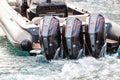 Monaco, Monte-Carlo, 27 September 2019: Three combined powerful motor engines by the rubber boat in operation, black