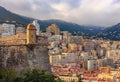 Skyline of Monaco Monte Carlo with residential buildings and mountains and the castle in the foreground Royalty Free Stock Photo